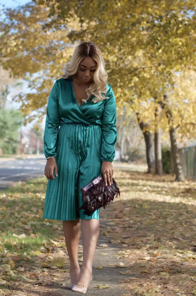 beautiful black woman in emerald green dress