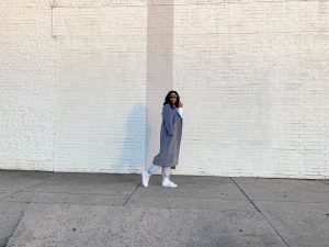 chimere nicole wearing a grey overcoat