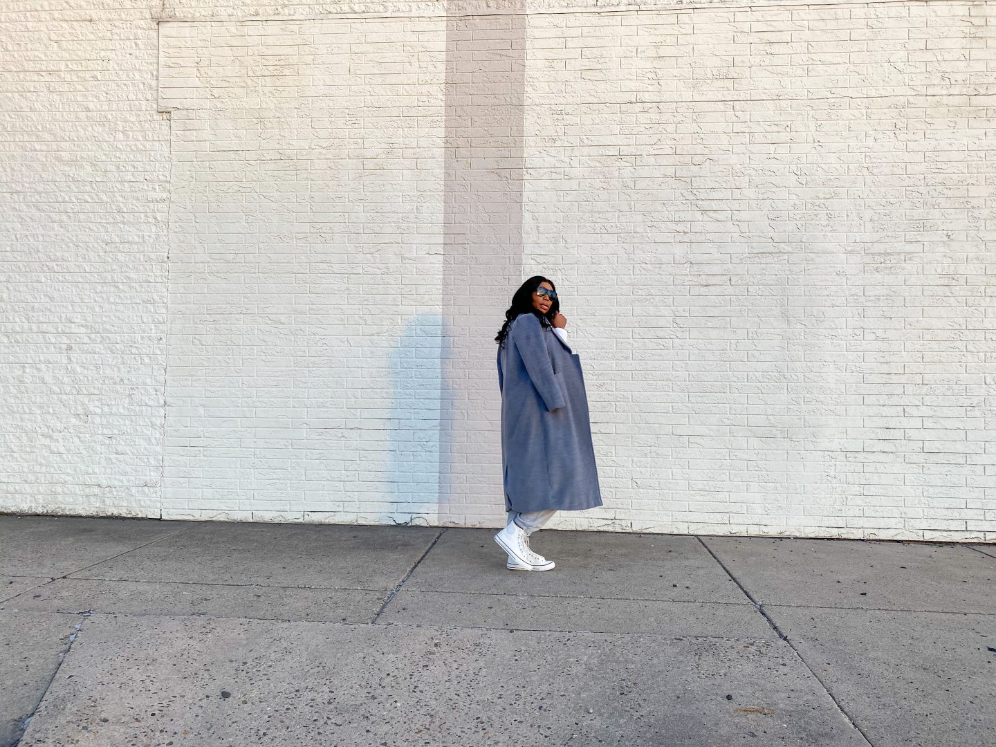 Black women wearing grey overcoat